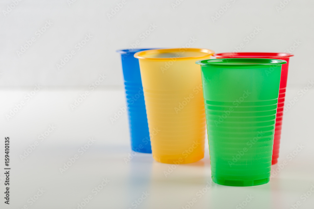 Multicolor disposable plastic glasses isolated on white background Multicolor disposable plastic glasses isolated on white background