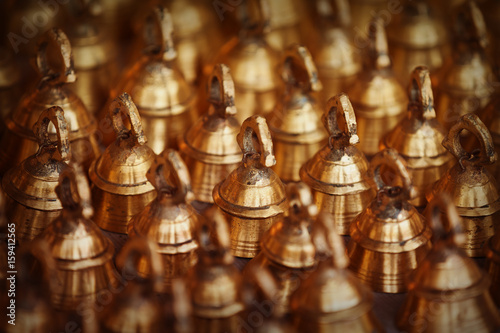 Large bells for cattle on the market counter. India, Pushkar