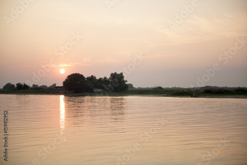 Breathtaking sunset in Danube Delta, Romania, in a summer day