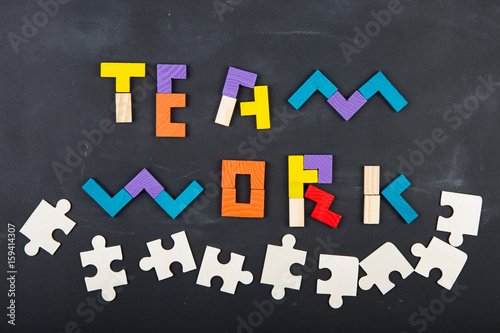 Teamwork creative concept concept jigsaw on the blackboard