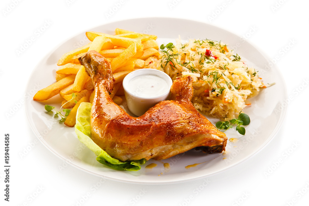 Roast chicken leg with french fries on white background