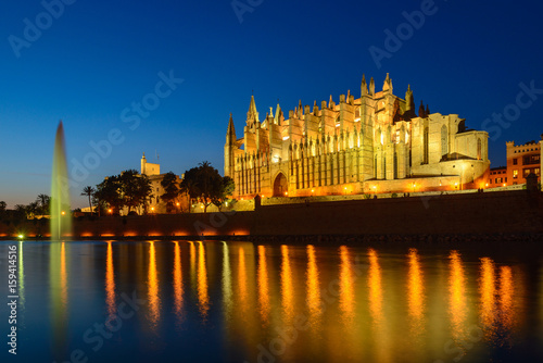 Illuminated Cathedral of Palma de Mallorca seen from Parc de la Mar  Spain 