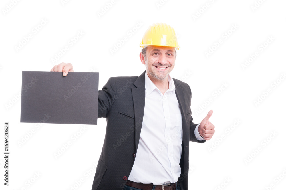 Portrait of contractor holding grey cardboard Portrait of contractor holding grey cardboard