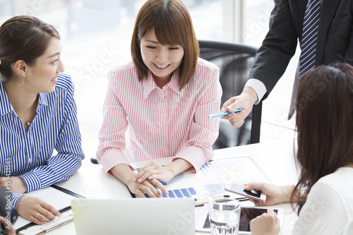 They are meeting at a bright office