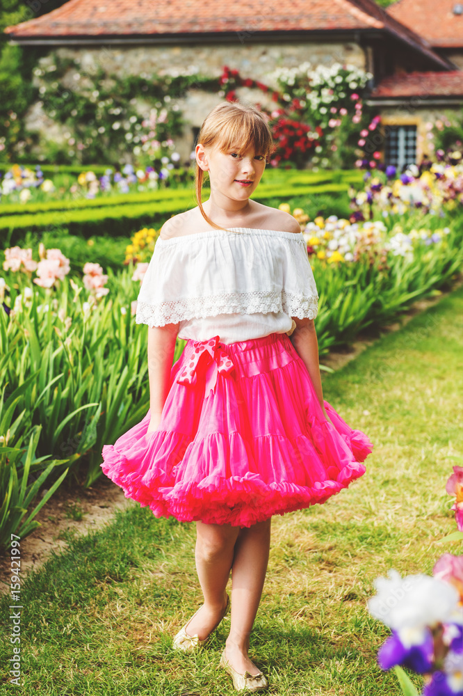 white blouse and bright pink tutu skirt 