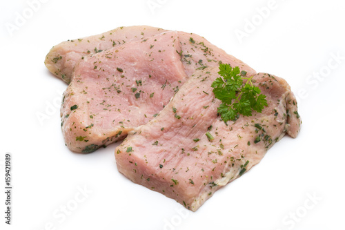 Steak with spices isolated on white background.