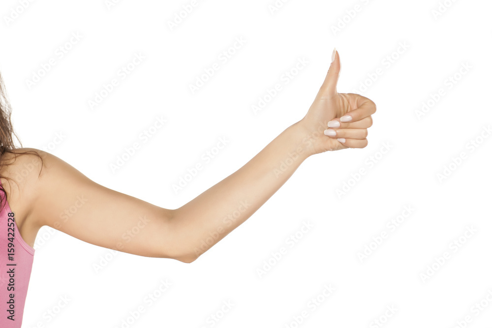 Side view of female hand showing thumbs up Side view of female hand showing thumbs up