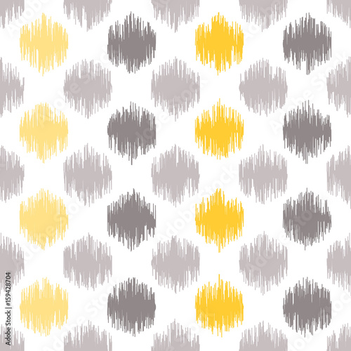 Seamless geometric pattern, based on ikat fabric style. Vector illustration. Carpet rug texture vector imitation. Yellow and grey spots pattern.