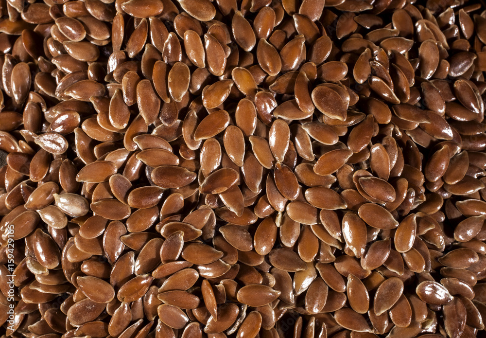 Background of brown flax seeds linseed. Background of brown flax seeds linseed.