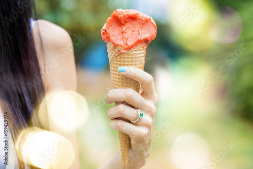 Tasty ice cream in beautiful female hand