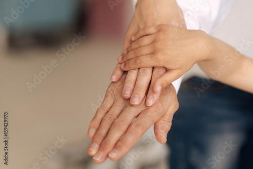 Fototapeta Naklejka Na Ścianę i Meble -  Beautiful female hands being put on each other