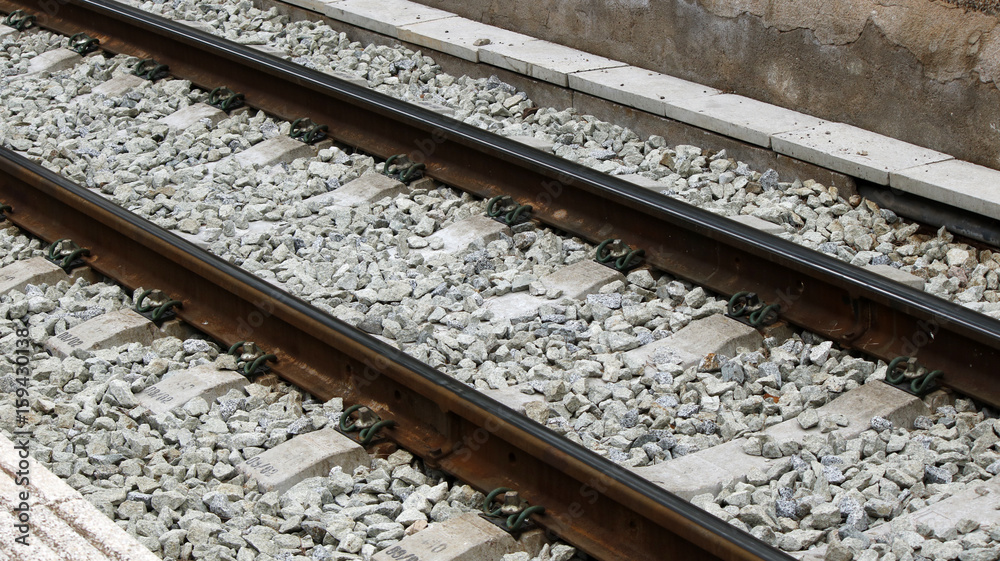 Railroad track with new clean gravel and the narrow standard track Railroad track with new clean gravel and the narrow standard track