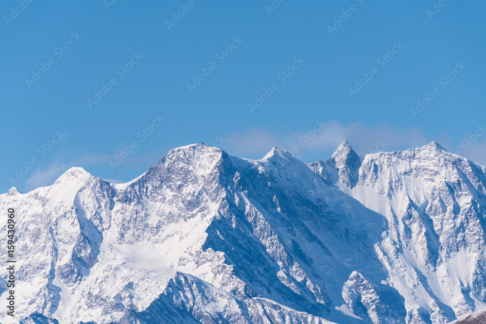 Snowy mountain crests of Mont Blanc in winter above snowy Vallee Blanche Chamonix