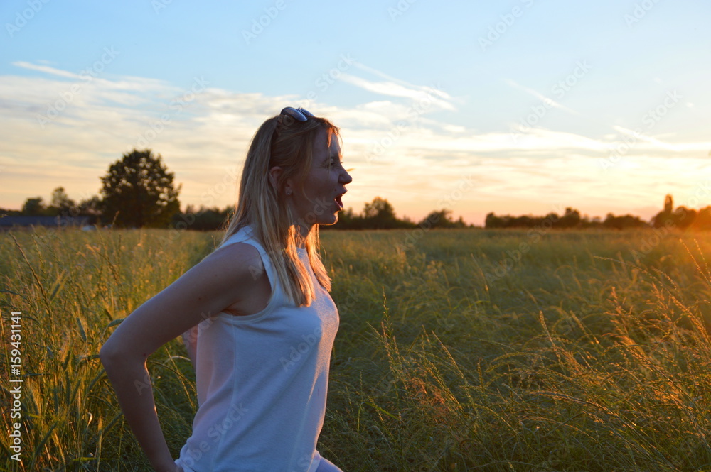 Young woman in the sunset Young woman in the sunset
