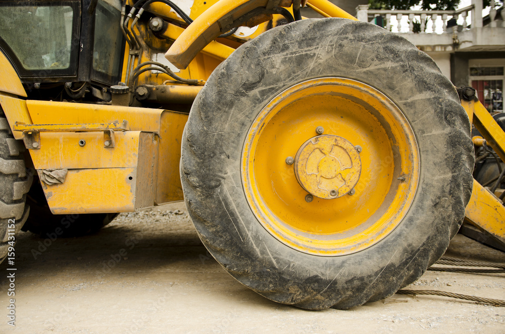 Heavy Industrial Excavator Wheel Closeup Heavy Industrial Excavator Wheel Closeup