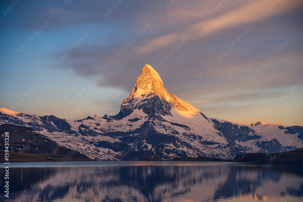 Colorful summer panorama of the Matterhorn pyramid and Stellisee lake. Few minutes before sunrise. Great june outdoor scene in Swiss Alps, Zermatt, Switzerland, Europe 2017