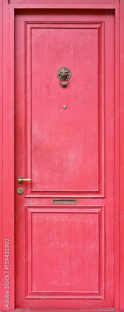 Fototapeta premium Detail antique chinese red door with oriental lion door knocker.