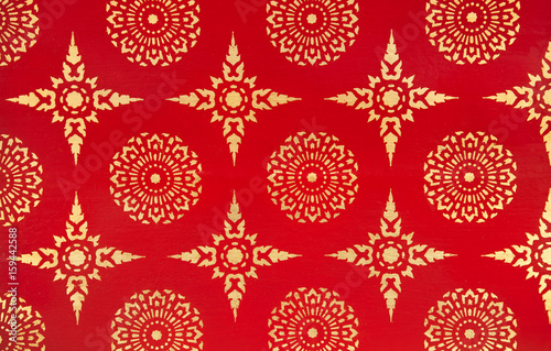 Ancient Traditional Thai Design Painting with Golden Stars and Flowers on Red Background