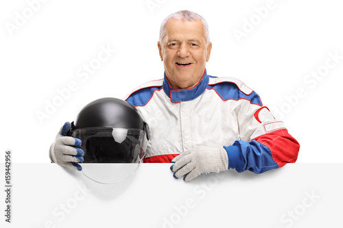 Elderly car racer behind a panel