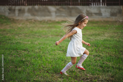 little beautiful running girl outside