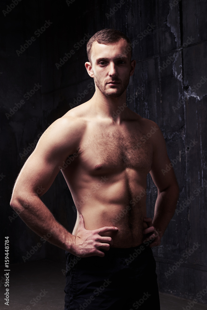 Fototapeta premium Muscular bare-chested muscular man posing