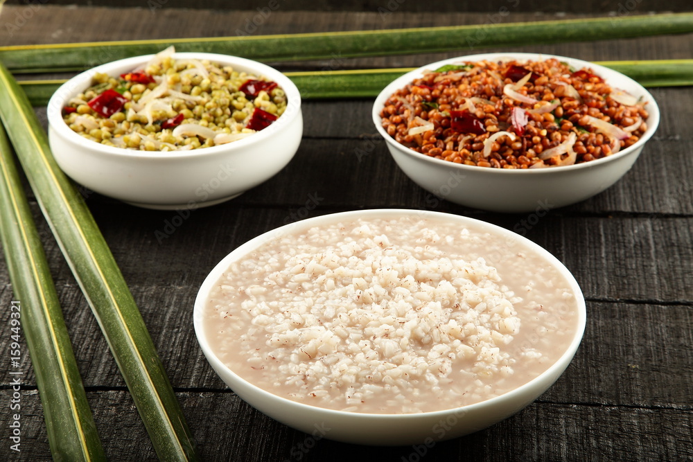 South Indian rice porridge Known as kanji served with bean curry. South Indian rice porridge Known as kanji served with bean curry.