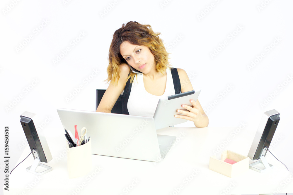 Gorgeous business woman working with tablet pc and phone in office isolated wide shot Gorgeous business woman working with tablet pc and phone in office isolated wide shot