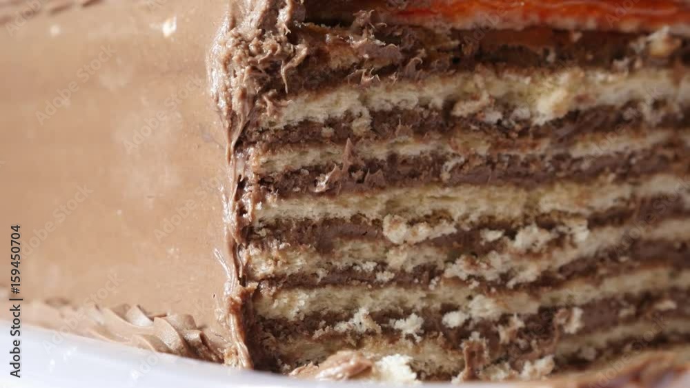 Tilting on layers of tasty torte with biscuits 4K 2160p 30fps UltraHD footage - Creamy chocolate cake on the plate slow tilt 3840X2160 UHD video
