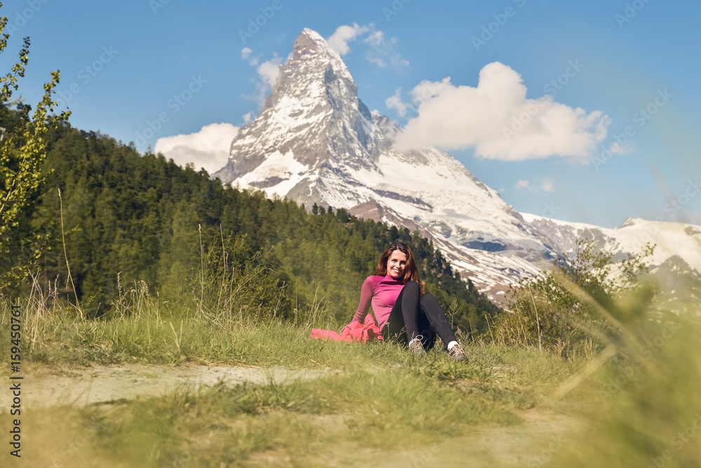 Girl relaxing in the beautiful Alps near Matterhorn and Zermatt, Switzerland, Europe 2017