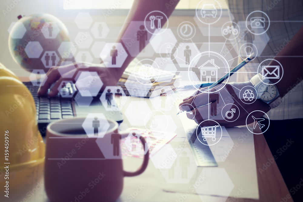 Obraz premium Architect drawing construction plan with laptop.