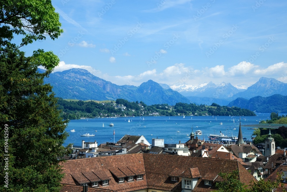 Beautiful view of the lake Lucerne (Vierwaldstättersee) and the Alps over the red roofs
