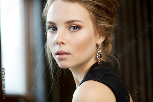 Portrait of a young woman in a studio