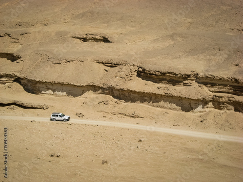 Four Wheel Drive White Car in Desert Valley photo