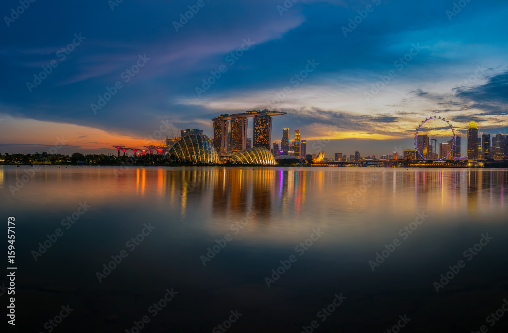 Cityscape of Singapore skyline, Singapore business district, marina bay sand and the garden by the bay on sunset.