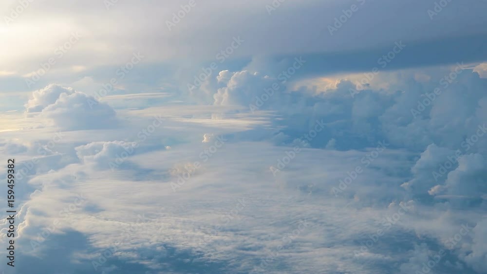 Clouds while flight.View through an airplane window. Clouds while flight.View through an airplane window.
