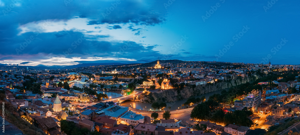 Tbilisi Georgia. Scenic Panoramic Top View Of Cityscape In Evening Bright Illumination