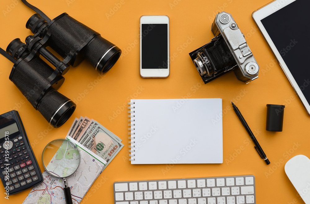 Flat lay of accessories on orange desk background Flat lay of accessories on orange desk background