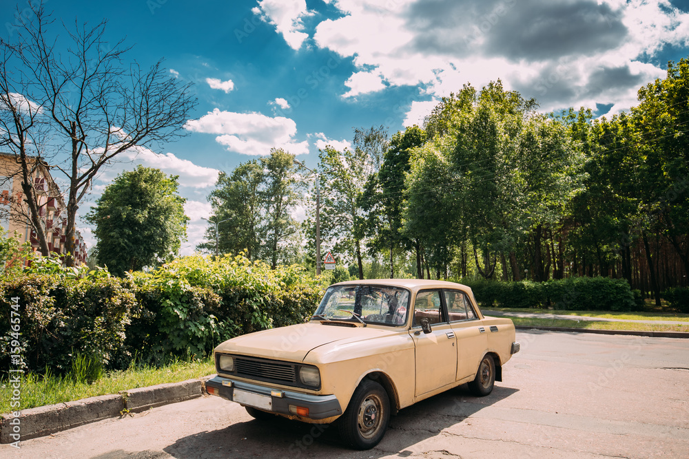 Russian Old Car Parking On Village Street In Sunny Summer Day