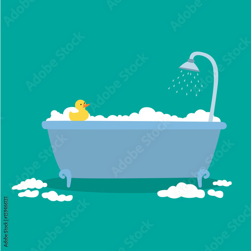 Bathtub with foam bubbles inside and bath yellow rubber duck isolated on blue background