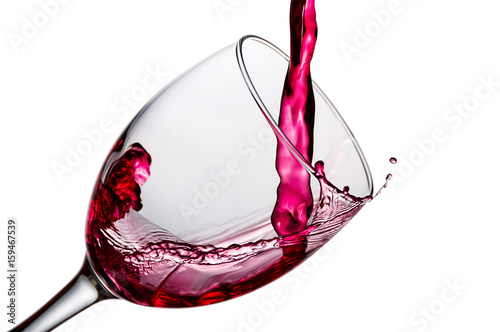 wine being pouring into a glass closeup, isolated