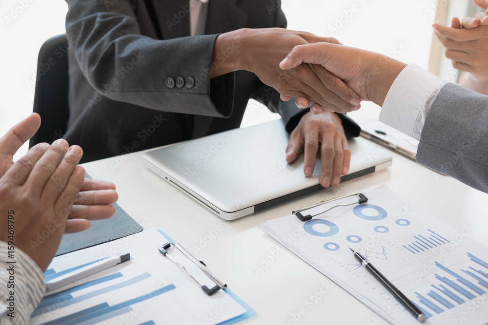 Business people shaking hands after finishing up a meeting. Businessman handshaking after conference. teamwork, partnership, collaboration, corporate concept. Business people shaking hands after finishing up a meeting. Businessman handshaking after conference. teamwork, partnership, collaboration, corporate concept.