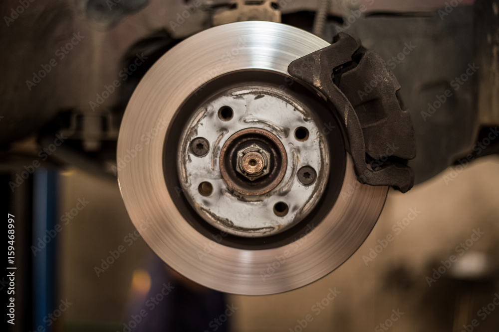 Car brake disc with no point, mechanic checks to see if everything is fine, car service Car brake disc with no point, mechanic checks to see if everything is fine, car service