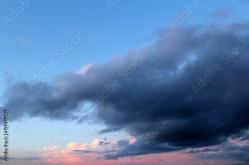 Beautiful sunset with pink clouds. Evening sky background.