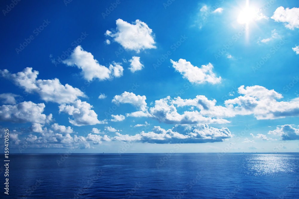 White cloudy with blue sky on the sea as background