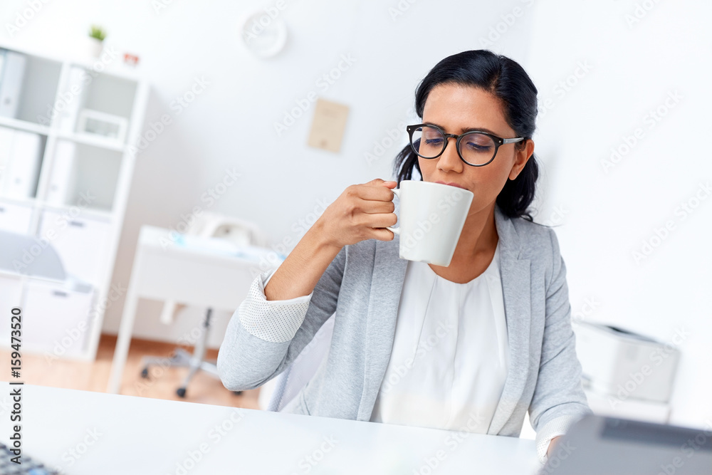 businesswoman drinking coffee or tea at office businesswoman drinking coffee or tea at office