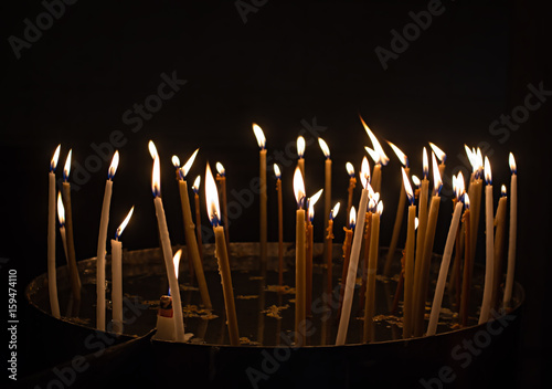 Burning candles in a church