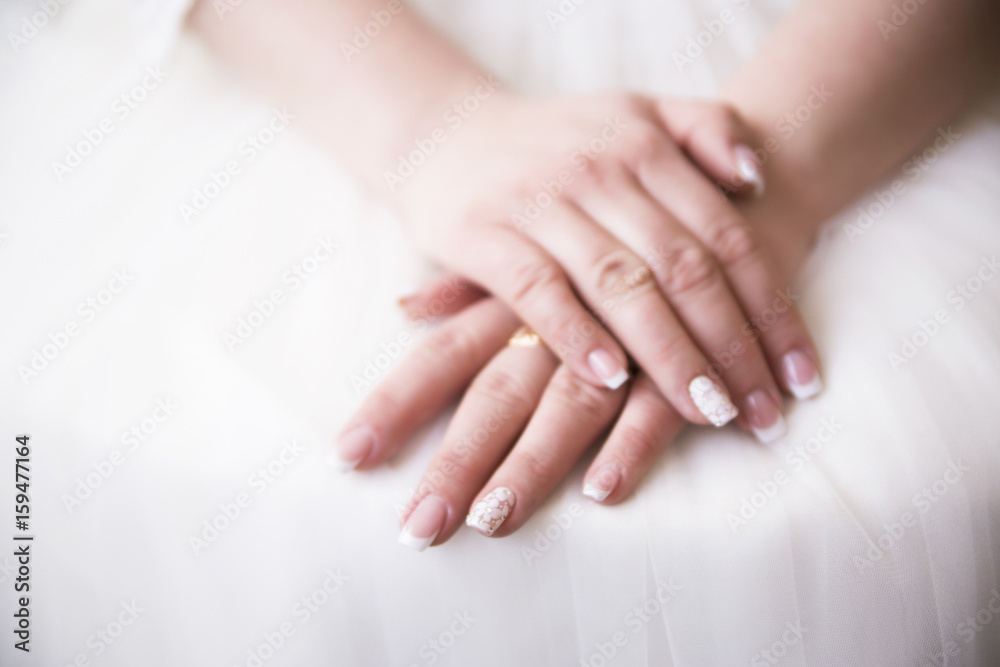 bride hand on white dress,ready for marriage ceremony