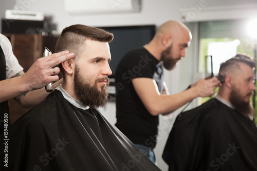 Professional barber doing a haircut