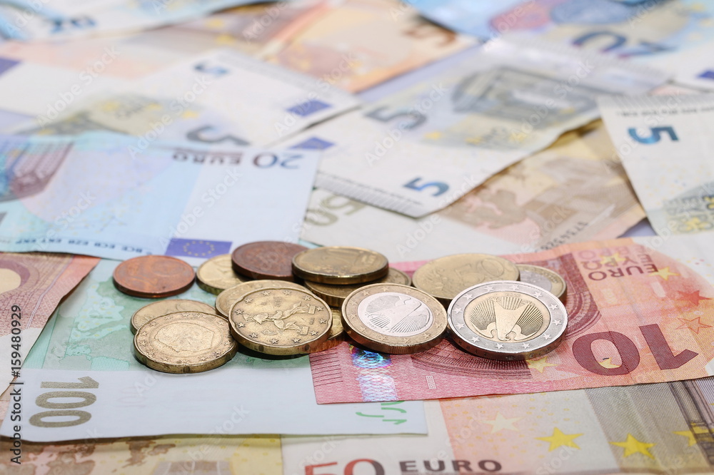 Euro bank notes with metal coins, bills background and texture Euro bank notes with metal coins, bills background and texture