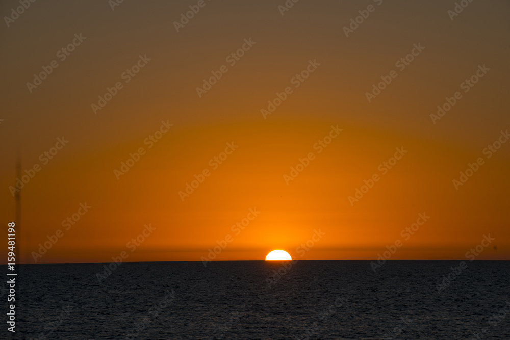 orange sunset over ocean 